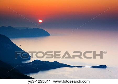 Sun setting beyond La Ballena de Sonabia and El Buciero in Satoa, view from the top of Monte Cerredo, Castro Urdiales, Cantabria, Spain. View Large Photo Image Stock Image - Sun setting beyond La Ballena de Sonabia and El Buciero in Satoa, view from the top of Monte Cerredo, Castro Urdiales, Cantabria, Spain.. Fotosearch