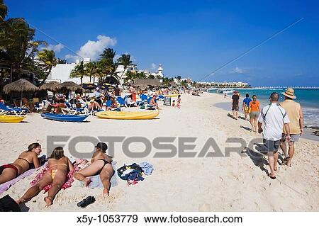 Sunbathers enjoying the turquoise waters and white sand beaches of Playa Del Carmen on the Yucatan Peninsula in Quintana Roo Mexico View Large Photo Image Stock Photo - Sunbathers enjoying the turquoise waters and white sand beaches of Playa Del Carmen on the Yucatan Peninsula in Quintana Roo Mexico. Fotosearch