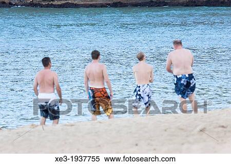 Stock Photography - Sunbathing at Waimea Bay. Fotosearch