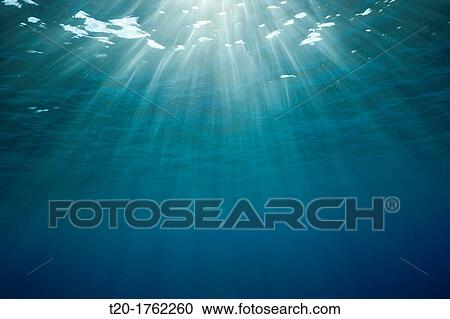 Sunbeams filtering through Water Surface, Caribbean Sea, Dominica View Large Photo Image Stock Image - Sunbeams filtering through Water Surface, Caribbean Sea, Dominica. Fotosearch