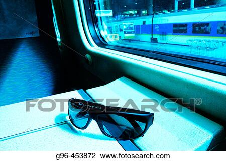 Stock Image - Sunglasses in train. Fotosearch