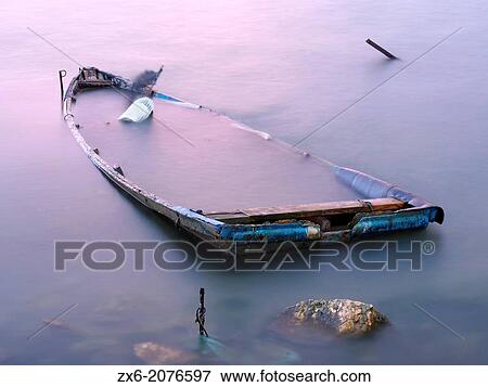 Sunken fishing boat at dawn in Alfacs Bay. Ebro River Delta Natural Park, Tarragona province, Catalonia, Spain. View Large Photo Image Stock Photo - Sunken fishing boat at dawn in Alfacs Bay. Ebro River Delta Natural Park, Tarragona province, Catalonia, Spain.. Fotosearch