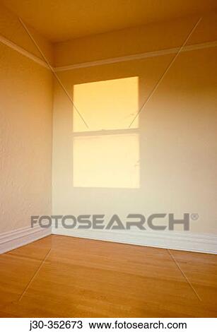 Stock Image - Sunlight from window shines on wall. Seattle. Washington, USA. Fotosearch