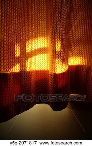 sunlight on orange curtains in room View Large Photo Image Stock Photo - sunlight on orange curtains in room. Fotosearch