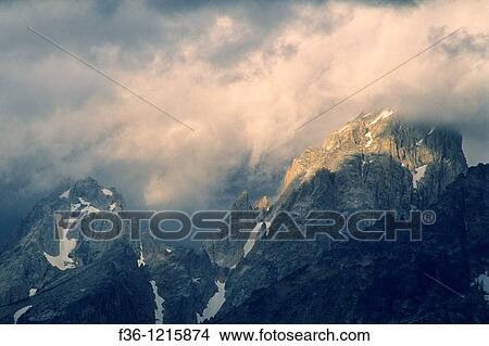 Sunlight on storm clouds near the summit of the Grand Tetons, Grand Teton Nat? l Pk, WYOMING View Large Photo Image Picture - Sunlight on storm clouds near the summit of the Grand Tetons, Grand Teton Nat? l Pk, WYOMING. Fotosearch