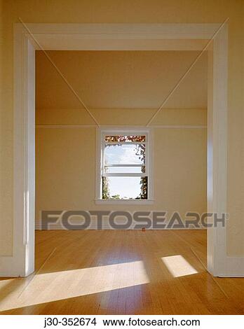 Sunlight rakes across floor of room with archway and window. Seattle. Washington, USA View Large Photo Image Picture - Sunlight rakes across floor of room with archway and window. Seattle. Washington, USA. Fotosearch