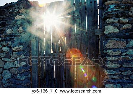 Sunlight shining through a fence in the Tabernas desert Almeria, Spain View Large Photo Image Stock Image - Sunlight shining through a fence in the Tabernas desert Almeria, Spain. Fotosearch