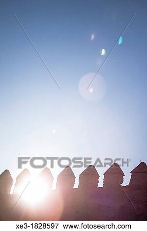 Stock Photo - Sunlight through battlements. City Wall, Avila, Spain.. Fotosearch