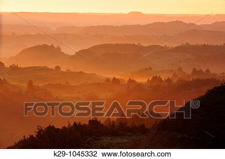 Sunrise and light fog from the Badlands Overlook View Large Photo Image Stock Image - Sunrise and light fog from the Badlands Overlook. Fotosearch