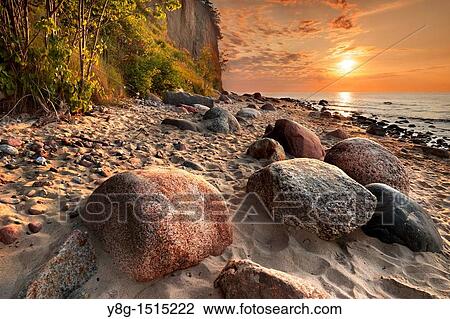 Stock Image - Sunrise at the Baltic Sea, Poland, Europe. Fotosearch