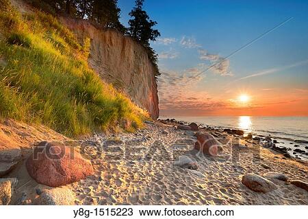 Stock Image - Sunrise at the Baltic Sea, Poland, Europe. Fotosearch