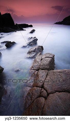 Stock Image - Sunrise at the Cotonera cove, Islares, Castro Urdiales, Cantabria, Spain. Fotosearch