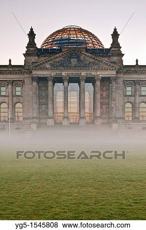 Sunrise behind the Reichstag German Parliament with morning fog, Government District, Berlin, Germany, frontal shot View Large Photo Image Stock Photo - Sunrise behind the Reichstag German Parliament with morning fog, Government District, Berlin, Germany, frontal shot. Fotosearch
