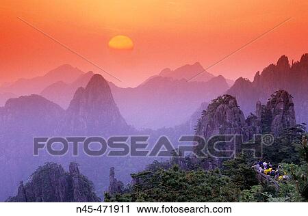 Sunrise, Chinese people, tourists are watching the sunrise. Huangshan mountains. China. View Large Photo Image Stock Image - Sunrise, Chinese people, tourists are watching the sunrise. Huangshan mountains. China.. Fotosearch