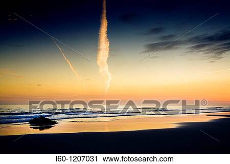 Stock Image - Sunrise in Las Catedrales beach Ribadeo Lugo province Galicia Spain. Fotosearch
