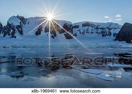 Sunrise in the Errera Channel, Antarctica, Southern Ocean. View Large Photo Image Stock Image - Sunrise in the Errera Channel, Antarctica, Southern Ocean.. Fotosearch