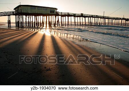 Sunrise on abandoned pier in North Carolina's Outer Banks USA View Large Photo Image Stock Image - Sunrise on abandoned pier in North Carolina's Outer Banks USA. Fotosearch
