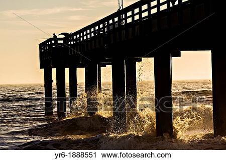 Sunrise over a fishing pier on St Augustine Beach, Florida View Large Photo Image Stock Image - Sunrise over a fishing pier on St Augustine Beach, Florida. Fotosearch