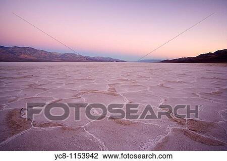 Stock Image - Sunrise over Badwater, Death Valley national park. Fotosearch