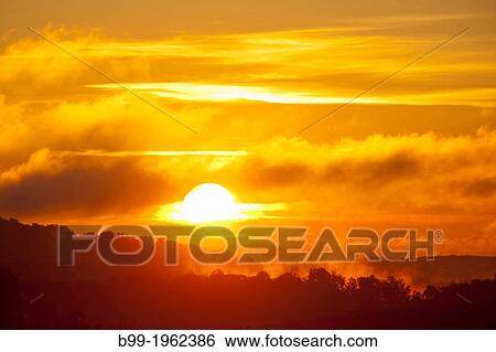 SUNRISE OVER MISTY LAND. View Large Photo Image Stock Photograph - SUNRISE OVER MISTY LAND.. Fotosearch