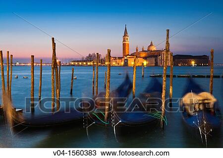 Sunrise over San Giorgio Maggiore with gondolas in the foreground, Venice, Italy, Europe View Large Photo Image Stock Image - Sunrise over San Giorgio Maggiore with gondolas in the foreground, Venice, Italy, Europe. Fotosearch
