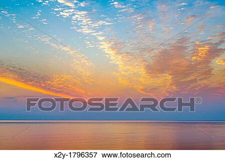 Sunrise over the ocean View Large Photo Image Stock Photo - Sunrise over the ocean. Fotosearch