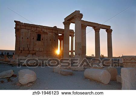 Stock Image - Sunrise over the ruins of the ancient city of Palmyra, Syria.. Fotosearch
