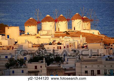 Sunrise over the traditional Greek windmills of Mykonos Chora Cyclades Islands, Greece View Large Photo Image Stock Image - Sunrise over the traditional Greek windmills of Mykonos Chora Cyclades Islands, Greece. Fotosearch
