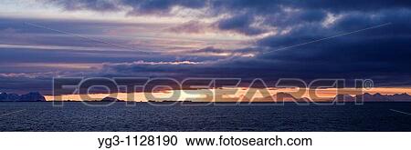 Sunrise over Vestfjord as viewed from Stamsund, Vestvagoy, Lofoten islands, Norway View Large Photo Image Stock Image - Sunrise over Vestfjord as viewed from Stamsund, Vestvagoy, Lofoten islands, Norway. Fotosearch