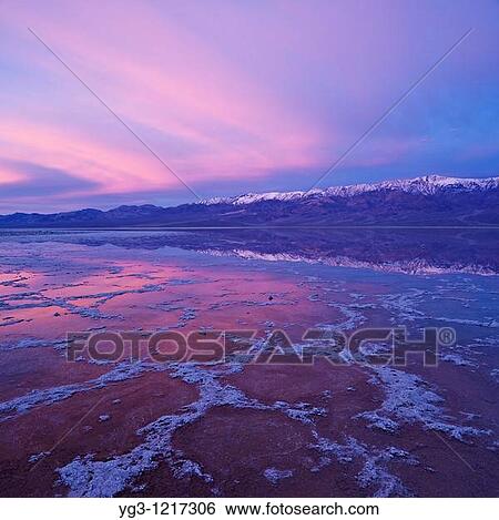 Sunrise reflection in Badwater Basin and Panamint mountains, Death Valley national park, California View Large Photo Image Stock Photograph - Sunrise reflection in Badwater Basin and Panamint mountains, Death Valley national park, California. Fotosearch