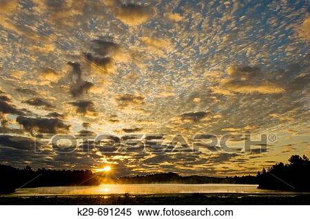 Sunrise skies over Anderson Lake, Ontario, Canada View Large Photo Image Stock Photography - Sunrise skies over Anderson Lake, Ontario, Canada. Fotosearch