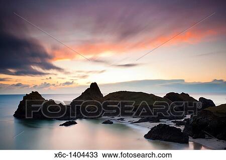 Sunset at Kynance Cove on the Lizard Peninsula Cornwall England UK View Large Photo Image Stock Image - Sunset at Kynance Cove on the Lizard Peninsula Cornwall England UK. Fotosearch