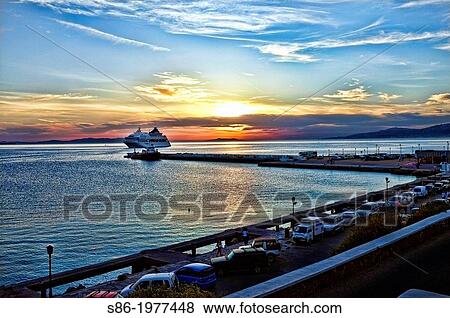 Sunset at Old Town Mykonos Harbor, Seen from a Harborside Restaurant. View Large Photo Image Stock Photo - Sunset at Old Town Mykonos Harbor, Seen from a Harborside Restaurant.. Fotosearch