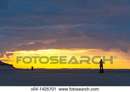 Sunset at the beach on the east frisian island of Spiekeroog, Lower Saxony, Germany, Europe View Large Photo Image Stock Image - Sunset at the beach on the east frisian island of Spiekeroog, Lower Saxony, Germany, Europe. Fotosearch