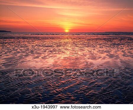 Sunset at Westward Ho! beach, North Devon, England. View Large Photo Image Stock Photo - Sunset at Westward Ho! beach, North Devon, England.. Fotosearch