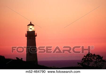 Stock Image - Sunset at Yaquina Head lighthouse. Oregon, USA. Fotosearch