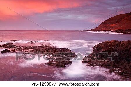Stock Photo - Sunset from El Confital, La Isleta, Las Palmas, Gran Canaria, Canary Islands, Spain. Fotosearch