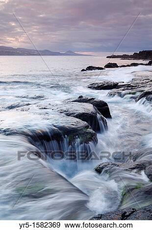 Stock Photo - Sunset from El Confital, Las Palmas, Gran Canaria, Canary Islands, Spain. Fotosearch