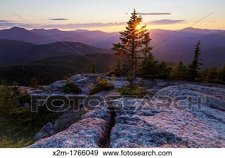 Sunset from Middle Sister Mountain in Albany, New Hampshire USA during the summer months View Large Photo Image Stock Photo - Sunset from Middle Sister Mountain in Albany, New Hampshire USA during the summer months. Fotosearch