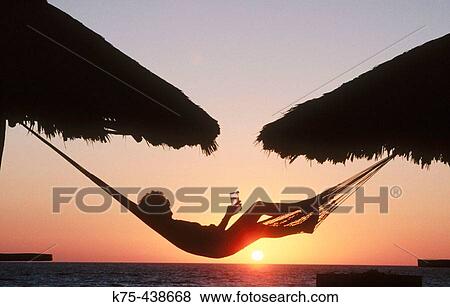 Sunset in a hammock View Large Photo Image Stock Photo - Sunset in a hammock. Fotosearch