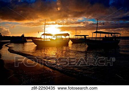 Sunset in Garapua Beach. Tinhare Island, Bahia, Brazil. View Large Photo Image Stock Photography - Sunset in Garapua Beach. Tinhare Island, Bahia, Brazil.. Fotosearch