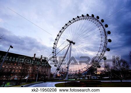 Stock Photo - Sunset in London Eye in a typical english day, London, UK. Fotosearch