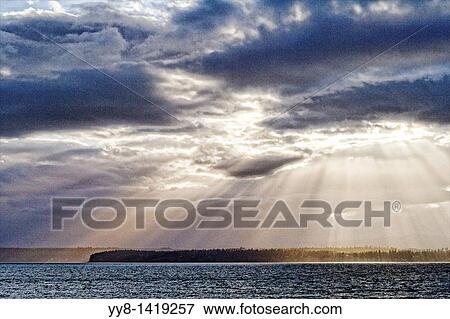 Stock Photo - Sunset in Puget Sound in state of Washington, USA. Fotosearch