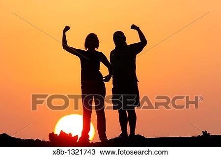 Sunset in the Galapagos on a young couple View Large Photo Image Stock Image - Sunset in the Galapagos on a young couple. Fotosearch