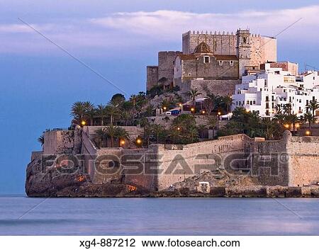 Sunset in the Mediterranean Sea and the Castillo del Papa Luna at the top of the town of Peniscola - Baix Maestrat - Castellon - Valencia View Large Photo Image Stock Image - Sunset in the Mediterranean Sea and the Castillo del Papa Luna at the top of the town of Peniscola - Baix Maestrat - Castellon - Valencia. Fotosearch