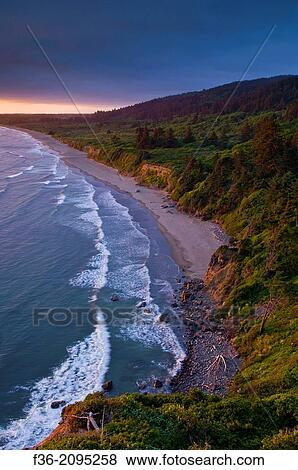 Sunset light and clouds over the hills above Enderts Beach, near Crescent City, Redwood National Park, California. View Large Photo Image Stock Photo - Sunset light and clouds over the hills above Enderts Beach, near Crescent City, Redwood National Park, California.. Fotosearch