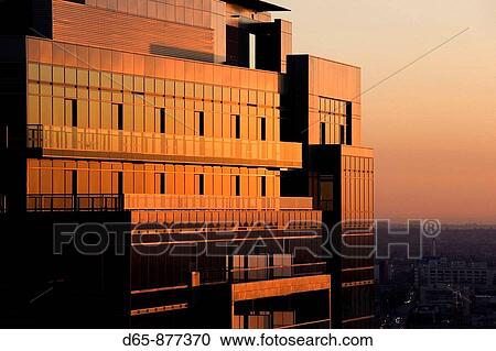 Stock Image - Sunset light on new residential building, downtown-Fashion District, Los Angeles, California, USA. Fotosearch