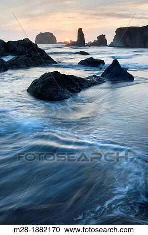 Sunset on Bandon Beach and Bandon Pinnacles, Bandon Oregon View Large Photo Image Stock Image - Sunset on Bandon Beach and Bandon Pinnacles, Bandon Oregon. Fotosearch