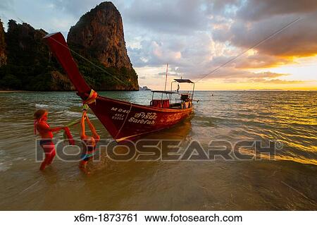 Stock Image - Sunset on the beach Railay Krabi province, Thailand. Fotosearch