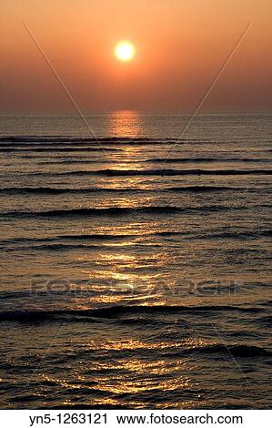 Sunset on the ocean along the french shore View Large Photo Image Stock Image - Sunset on the ocean along the french shore. Fotosearch